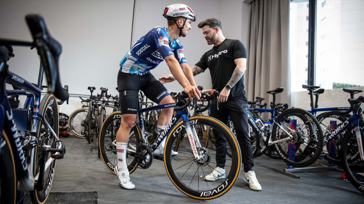 Hytro practitioner working with a professional cyclist between stages on the road